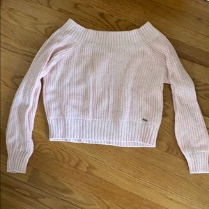 A pink sweater